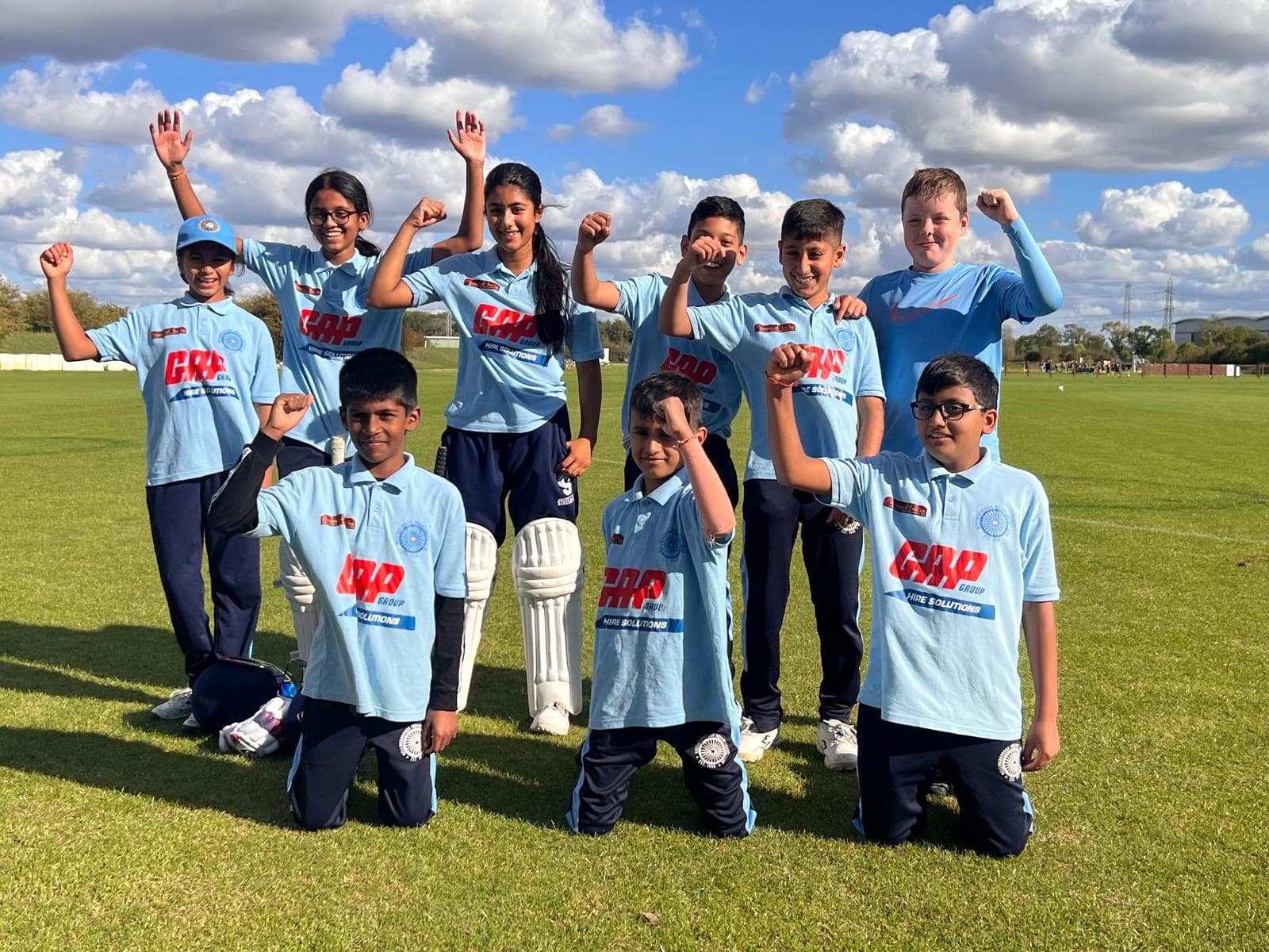 WICC youth cricket team celebrating on the pitch